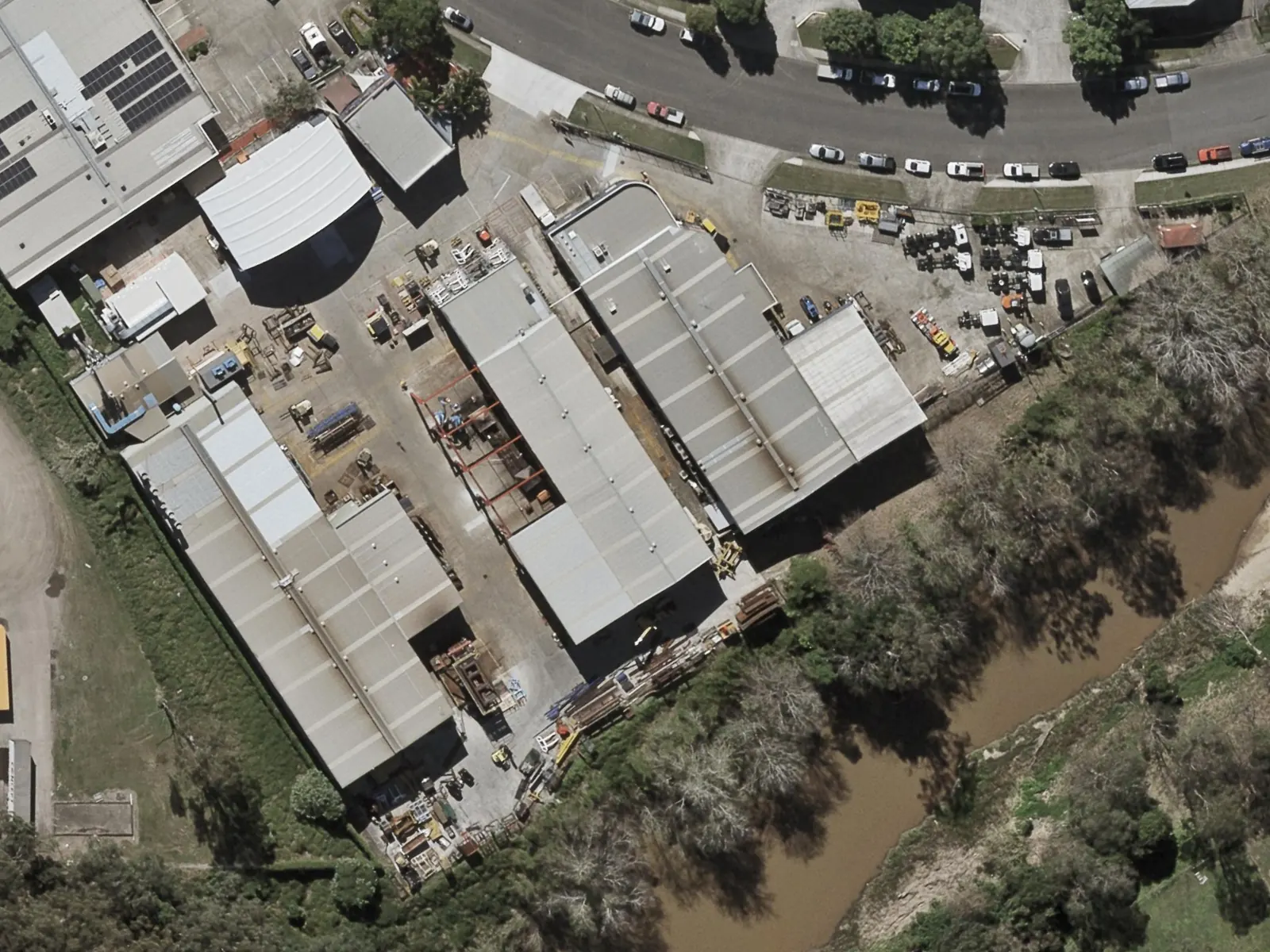 53 Success Street in 2022: connected workshops, the curved-roof front workshop and a busy yard