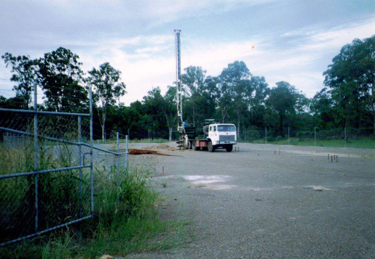 A piling rig drilling foundations on the bare Acacia Ridge block before the first workshop