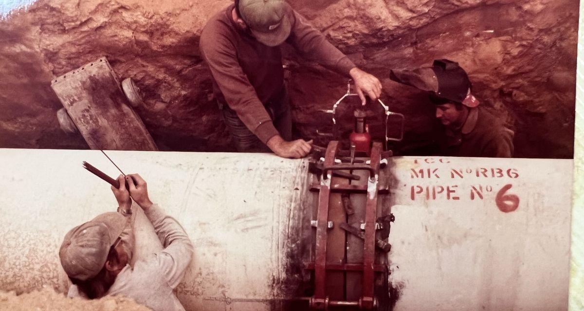 Pipe alignment clamp fitted to a pipe marked Pipe No 6 during weld preparation