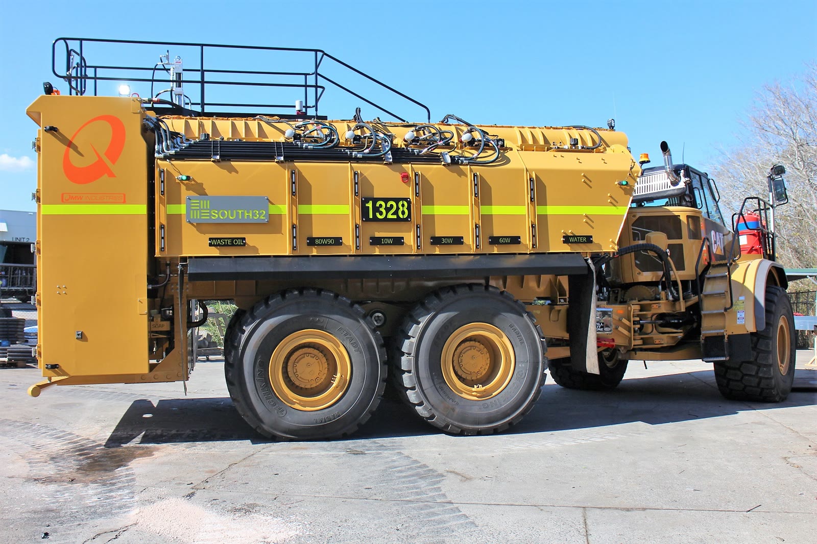 The South32 Cat 745C service module, with each product bay labelled: waste oil, gear oils, engine oils and water