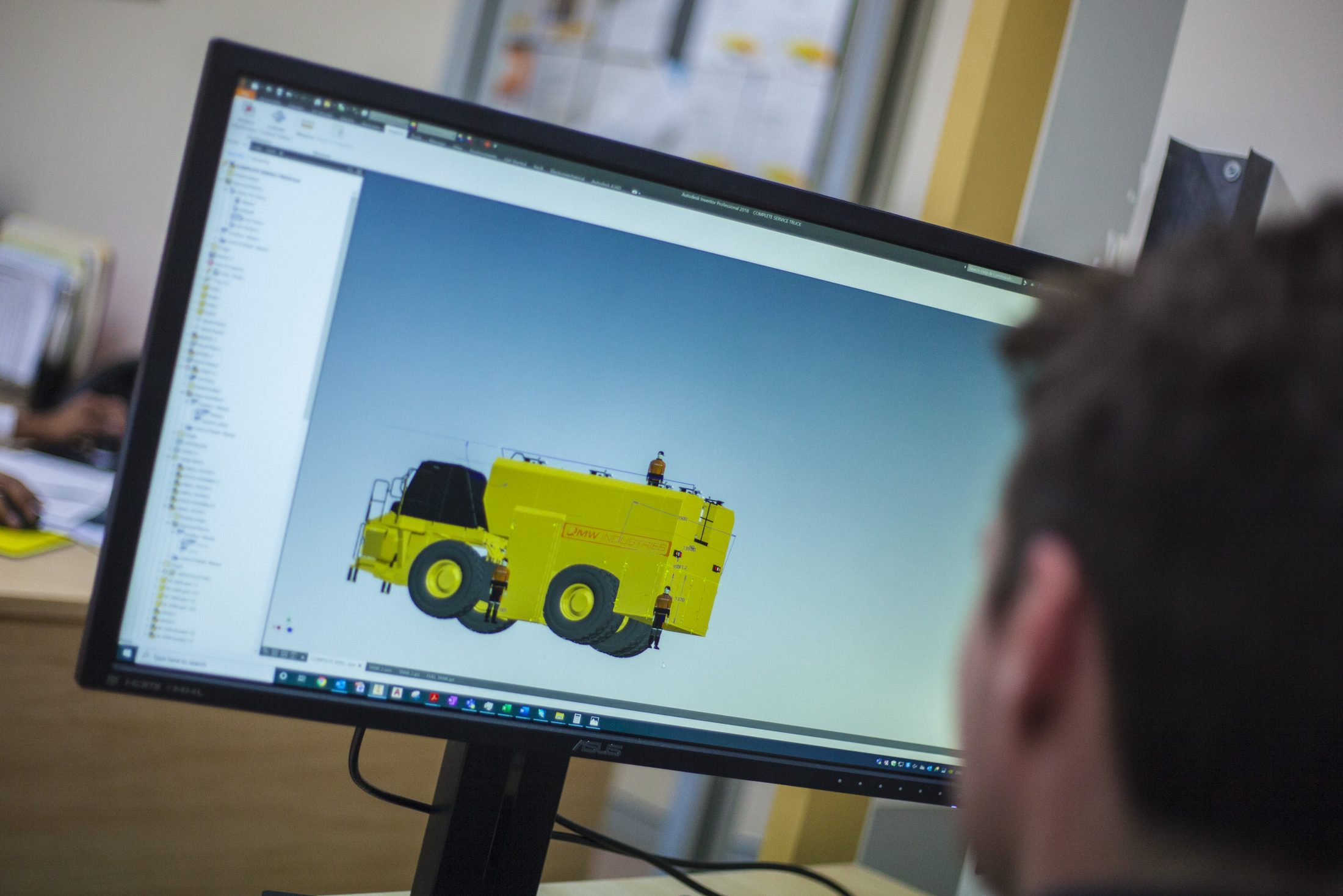QMW engineering team reviewing a design